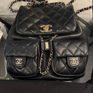 CHANEL Black Quilted Backpack with Gold Accents